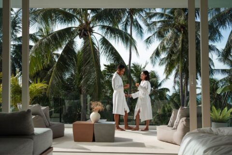 couple-wearing-robe-on-honeymoon-in-the-resort