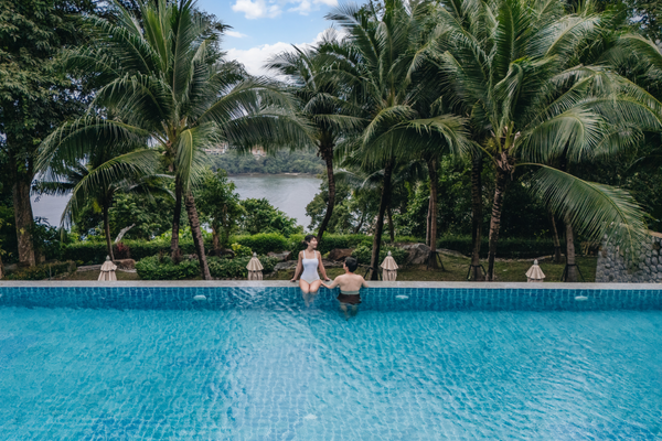 wyndham grand phuket kalim bay couple in swimming pool