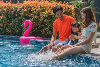 mother-father-kid-family-swimming-pool-resort