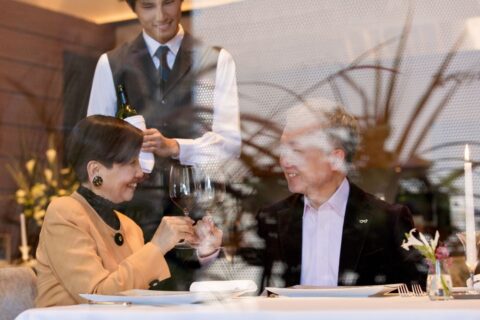 old-japanese-couple-wine-toasting-in-restaurant